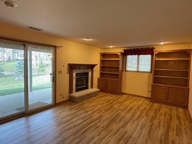 unfurnished living room featuring hardwood / wood-style flooring