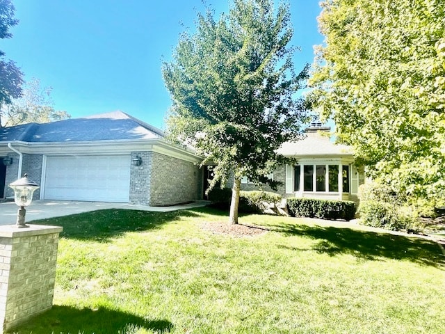 exterior space featuring a garage and a front lawn