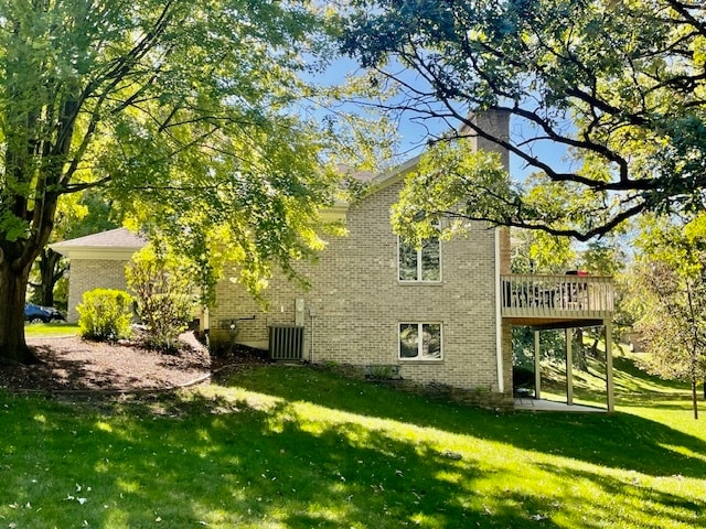 view of property exterior featuring a deck and a yard