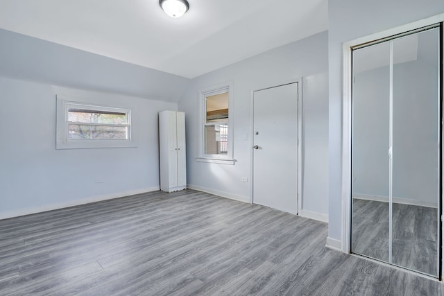 unfurnished bedroom with wood-type flooring