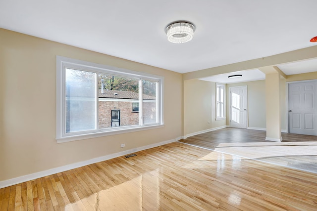 unfurnished room featuring light wood-type flooring