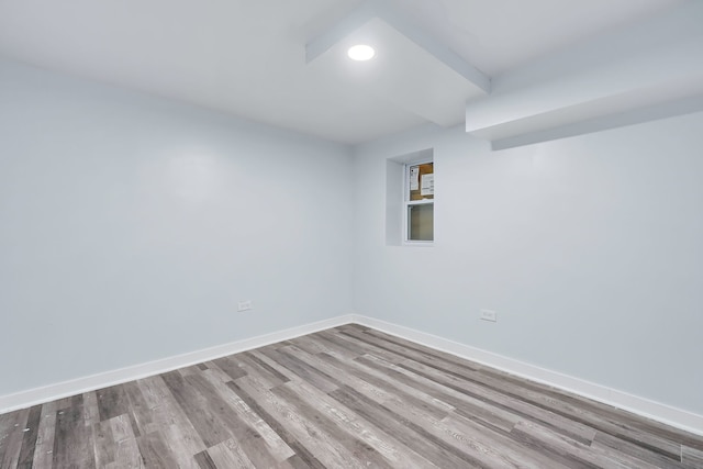 spare room with light wood-type flooring