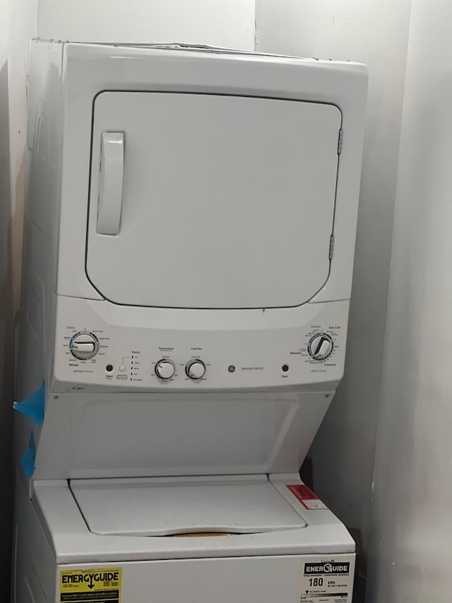 laundry area featuring laundry area and stacked washer / drying machine