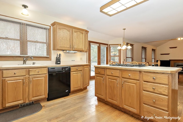 kitchen with stainless steel gas stovetop, dishwasher, a notable chandelier, decorative light fixtures, and light hardwood / wood-style floors