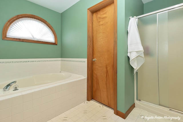 bathroom with tile patterned flooring and independent shower and bath