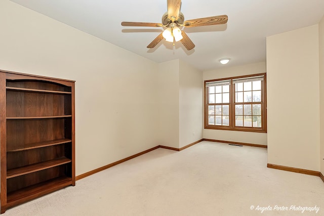 carpeted empty room with ceiling fan