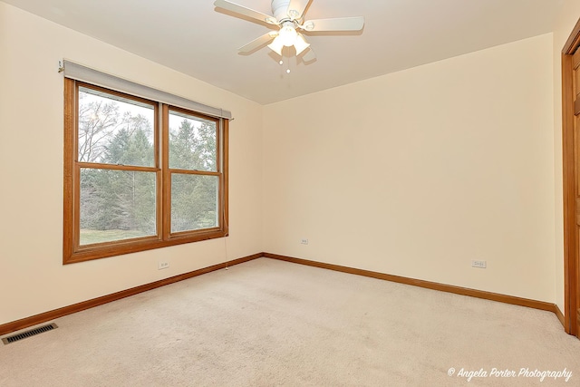 unfurnished room featuring carpet flooring and ceiling fan