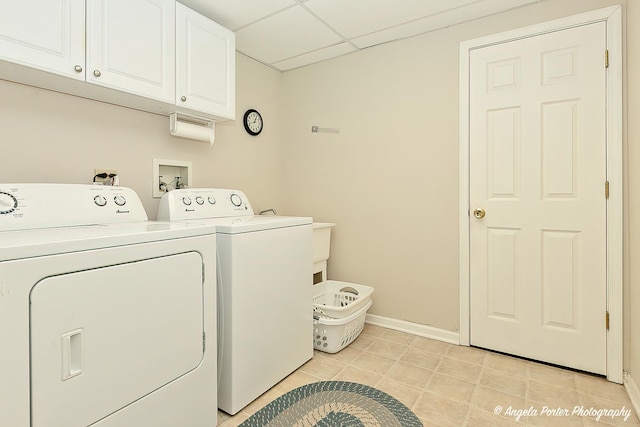 laundry room with cabinets and washer and clothes dryer