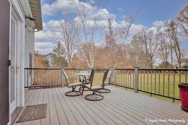 wooden deck with a yard