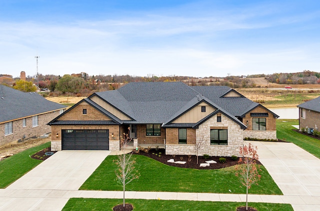 view of front of home with a garage and a front yard