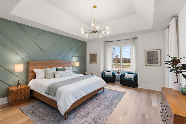 11060 Lizmore Ln Unit 27B, Orland Park, IL 60467 - bedroom featuring a chandelier, light wood-style floors, and baseboards
