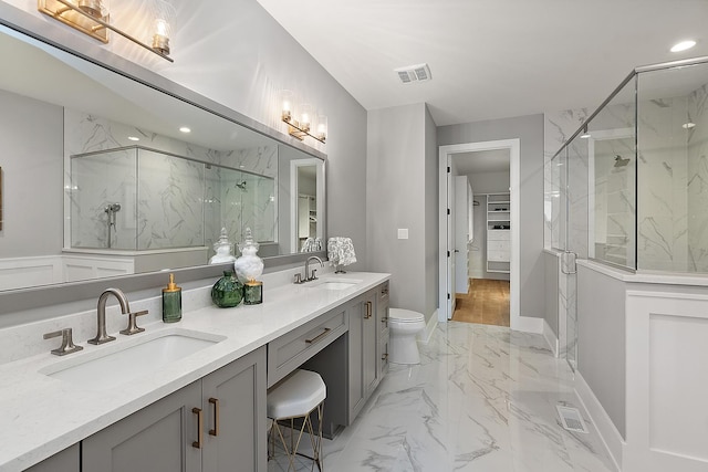11060 Lizmore Ln Unit 27B, Orland Park, IL 60467 - bathroom with marble tiled floors, a marble finish shower, double vanity, recessed lighting, and toilet