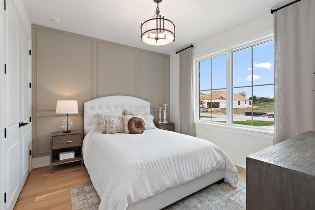 11060 Lizmore Ln Unit 27B, Orland Park, IL 60467 - bedroom featuring light wood finished floors and baseboards
