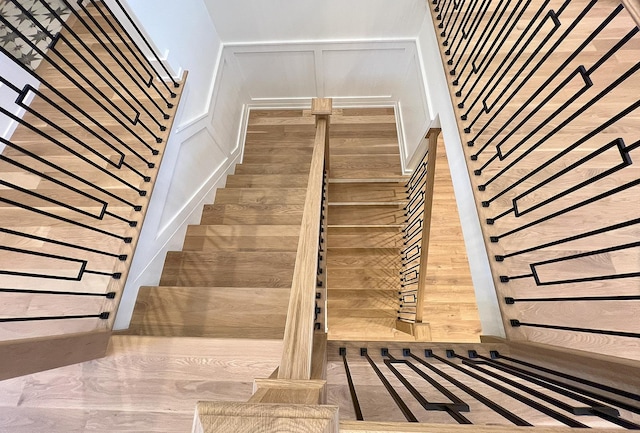 stairs featuring wood-type flooring