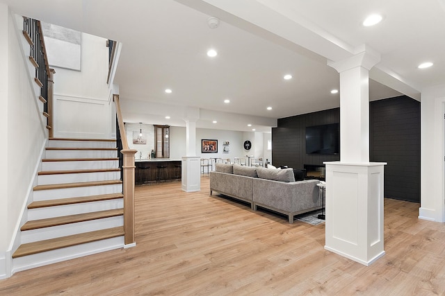 11060 Lizmore Ln Unit 27B, Orland Park, IL 60467 - living room featuring decorative columns, light wood-style flooring, stairway, recessed lighting, and baseboards