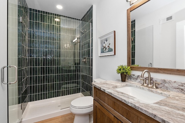 11060 Lizmore Ln Unit 27B, Orland Park, IL 60467 - bathroom featuring toilet, a stall shower, vanity, and recessed lighting