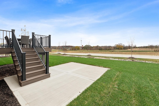 11060 Lizmore Ln Unit 27B, Orland Park, IL 60467 - view of grassy yard with stairway, a deck with water view, and a patio