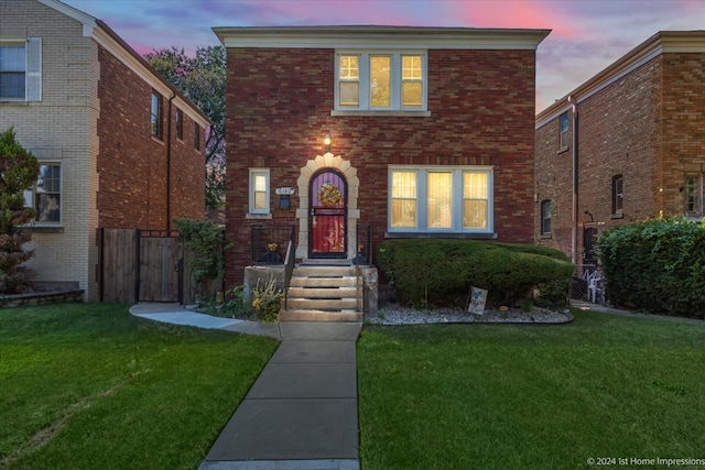 view of front of house with a yard