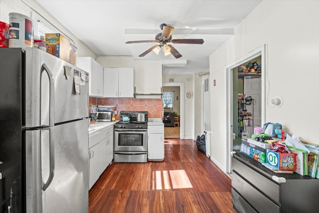 kitchen featuring ceiling fan, white cabinets, backsplash, dark wood-type flooring, and stainless steel appliances