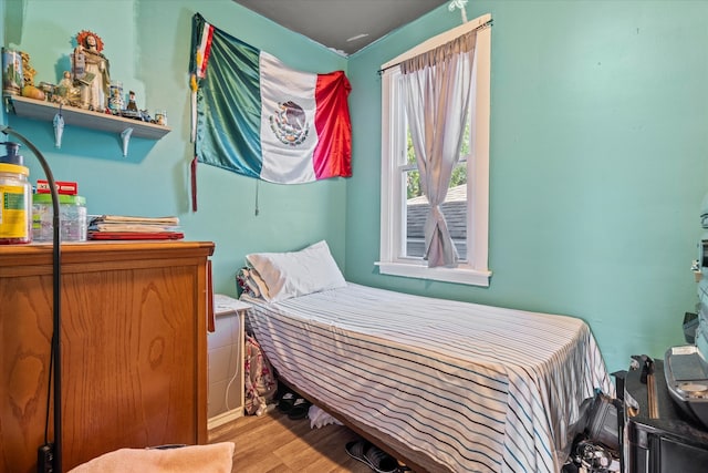 bedroom with light hardwood / wood-style flooring