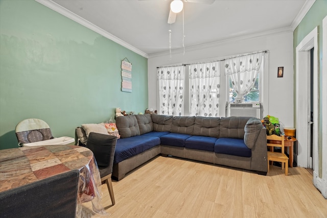 living room featuring ornamental molding, light wood-type flooring, ceiling fan, and cooling unit