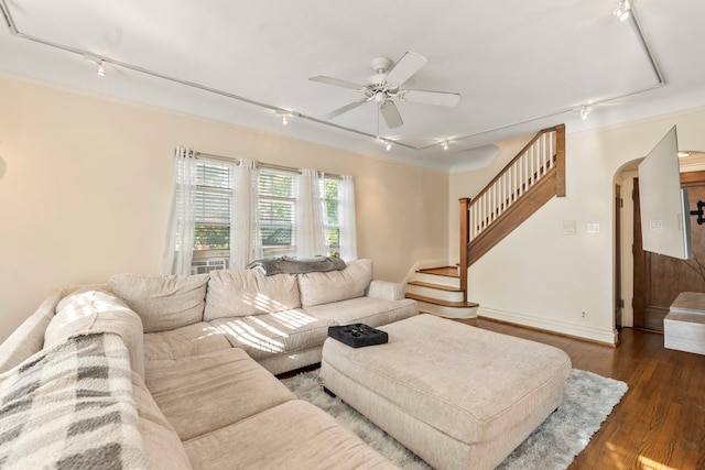 living room featuring ceiling fan, dark wood-type flooring, and rail lighting