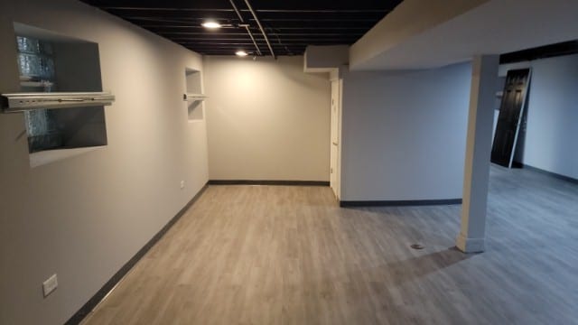 basement featuring hardwood / wood-style flooring