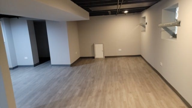 basement featuring light hardwood / wood-style flooring