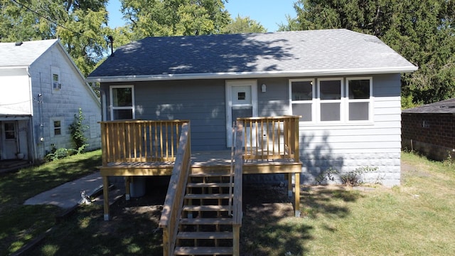 530 E Ash St, Watseka, IL 60970 - back of house with a yard, stairway, a deck, and roof with shingles