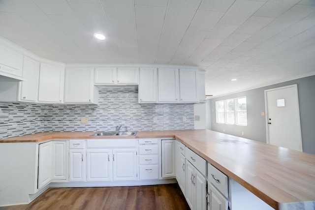 530 E Ash St, Watseka, IL 60970 - kitchen with a peninsula, wood counters, a sink, and white cabinetry