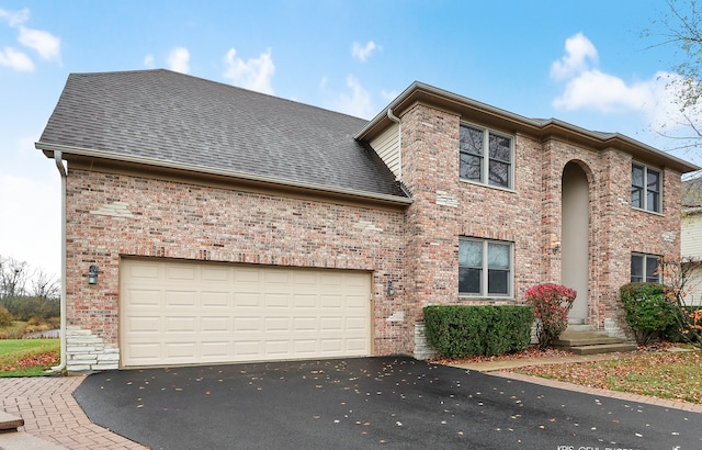 front facade with a garage