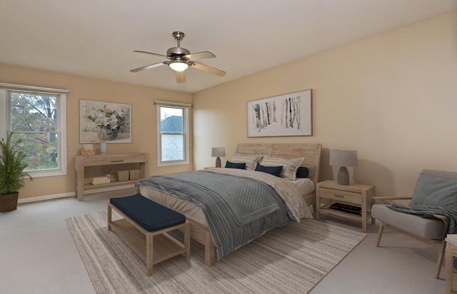 carpeted bedroom with ceiling fan and multiple windows