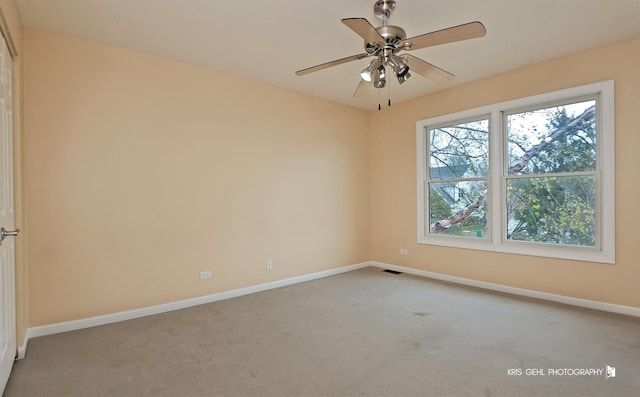 carpeted empty room with ceiling fan