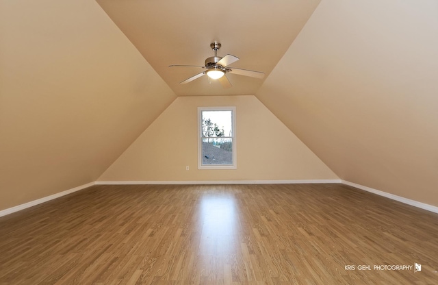 bonus room with lofted ceiling, ceiling fan, and wood-type flooring