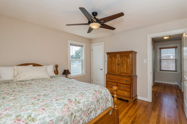 bedroom with ceiling fan and hardwood / wood-style flooring