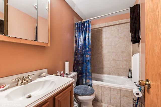 full bathroom with shower / tub combo with curtain, vanity, toilet, and tile patterned floors