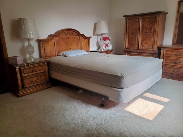 bedroom featuring light carpet