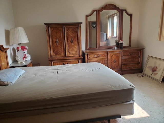 bedroom featuring light colored carpet