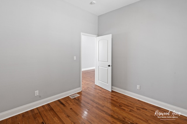 unfurnished room featuring wood-type flooring