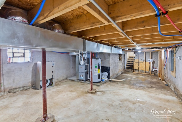 basement featuring heating unit and water heater