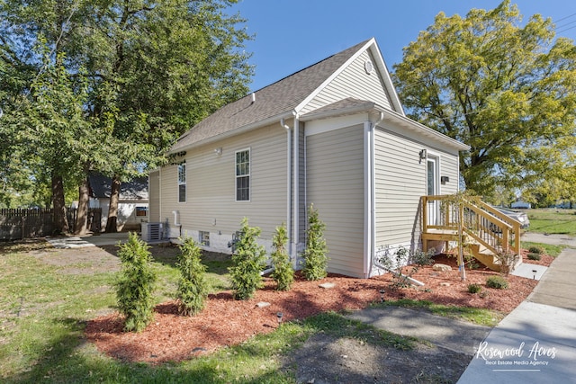 view of side of property featuring cooling unit