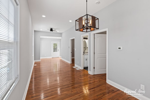 interior space featuring an inviting chandelier and dark hardwood / wood-style floors