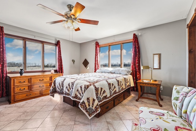 tiled bedroom with ceiling fan