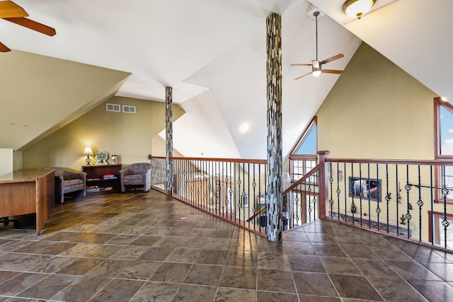 additional living space with high vaulted ceiling and ceiling fan