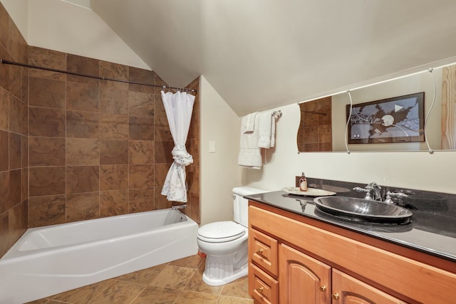 full bathroom featuring tile patterned flooring, vaulted ceiling, shower / tub combo with curtain, vanity, and toilet