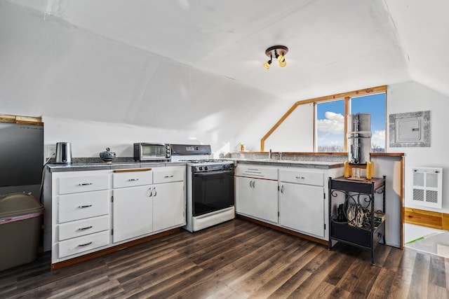 kitchen with white range with gas cooktop, dark hardwood / wood-style flooring, vaulted ceiling, and white cabinets