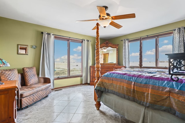 tiled bedroom with ceiling fan