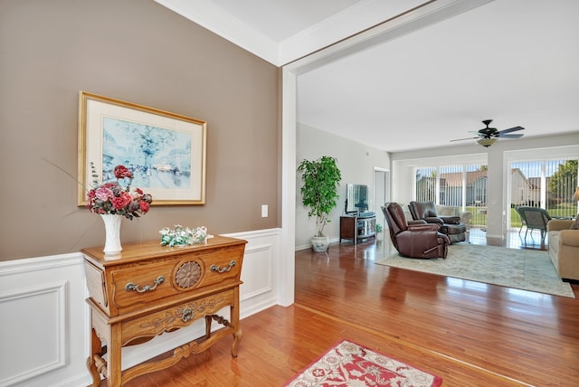 interior space with ceiling fan and hardwood / wood-style floors