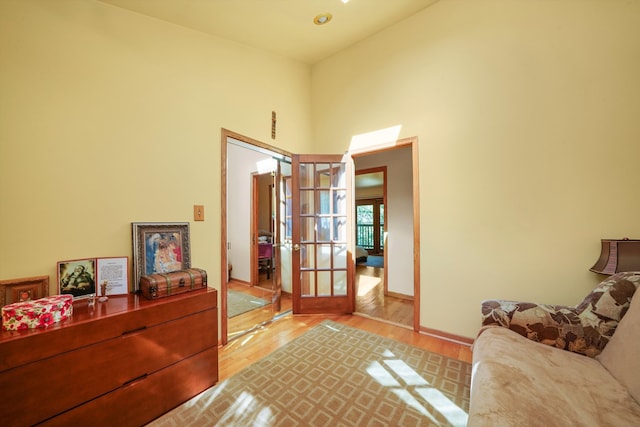 sitting room featuring light hardwood / wood-style floors and french doors