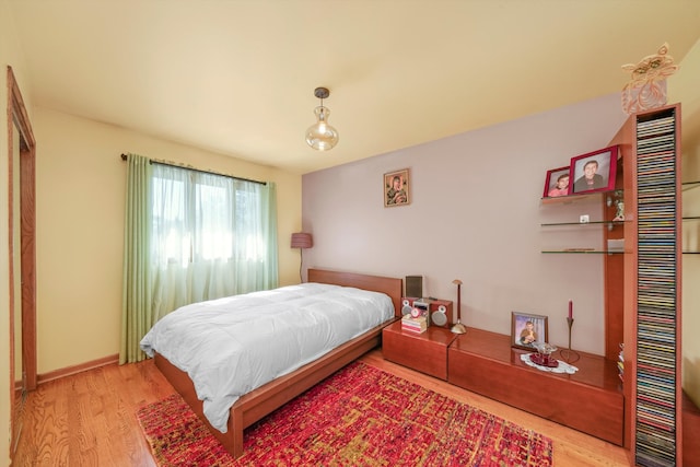 bedroom with light hardwood / wood-style floors